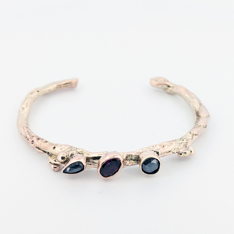 Sample shown set with Rhodolite garnet and two salt n pepper diamonds Sample shown set with Rhodolite garnet and two salt n pepper diamonds