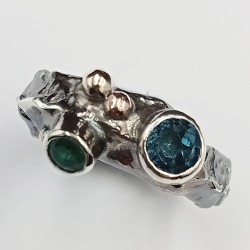 Shown with London blue topaz and an emerald